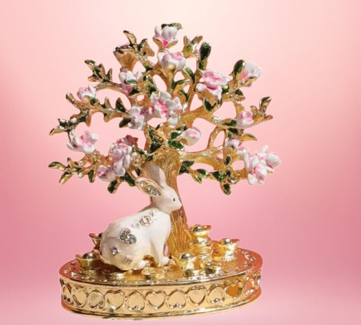 Whimsical Wonders: Exquisite White Rabbit Jewelry Display Stand amidst Cherry Blossom Tree